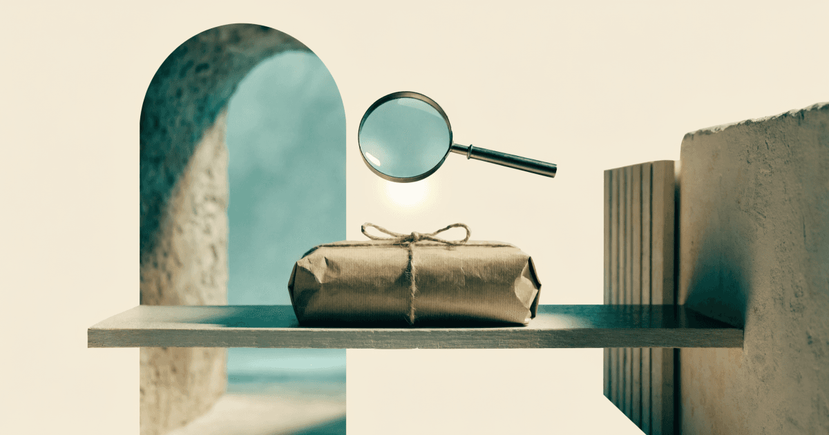A kraft paper parcel on a shelf illuminated by a magnifying glass, with an open archway on the left and a solid wall on the right.