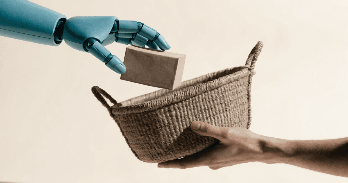 A matte teal robotic hand places a plain clay-colored shipping parcel into a woven basket held by a human hand.