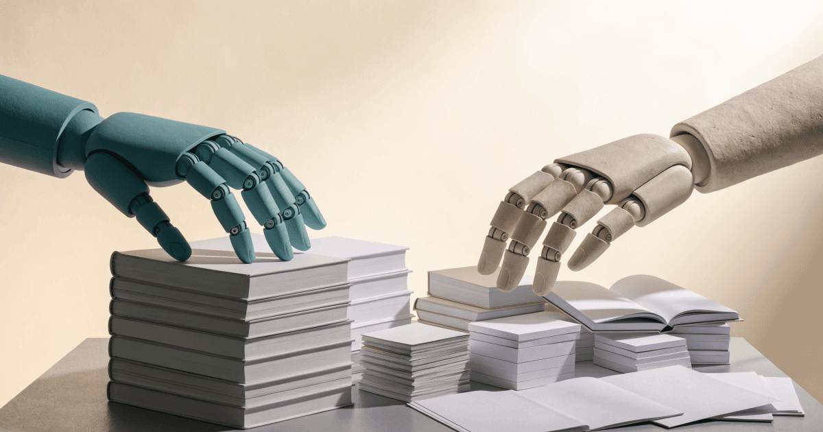 Two robotic hands select different source materials from a shared table, one reaching for a stack of books and the other for loose papers.